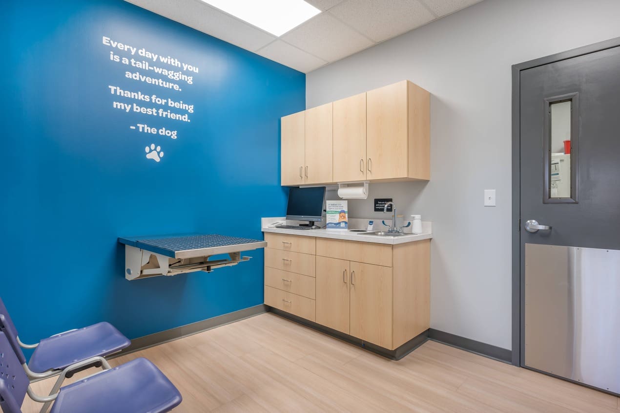 The inside of an exam room with a table unfolded