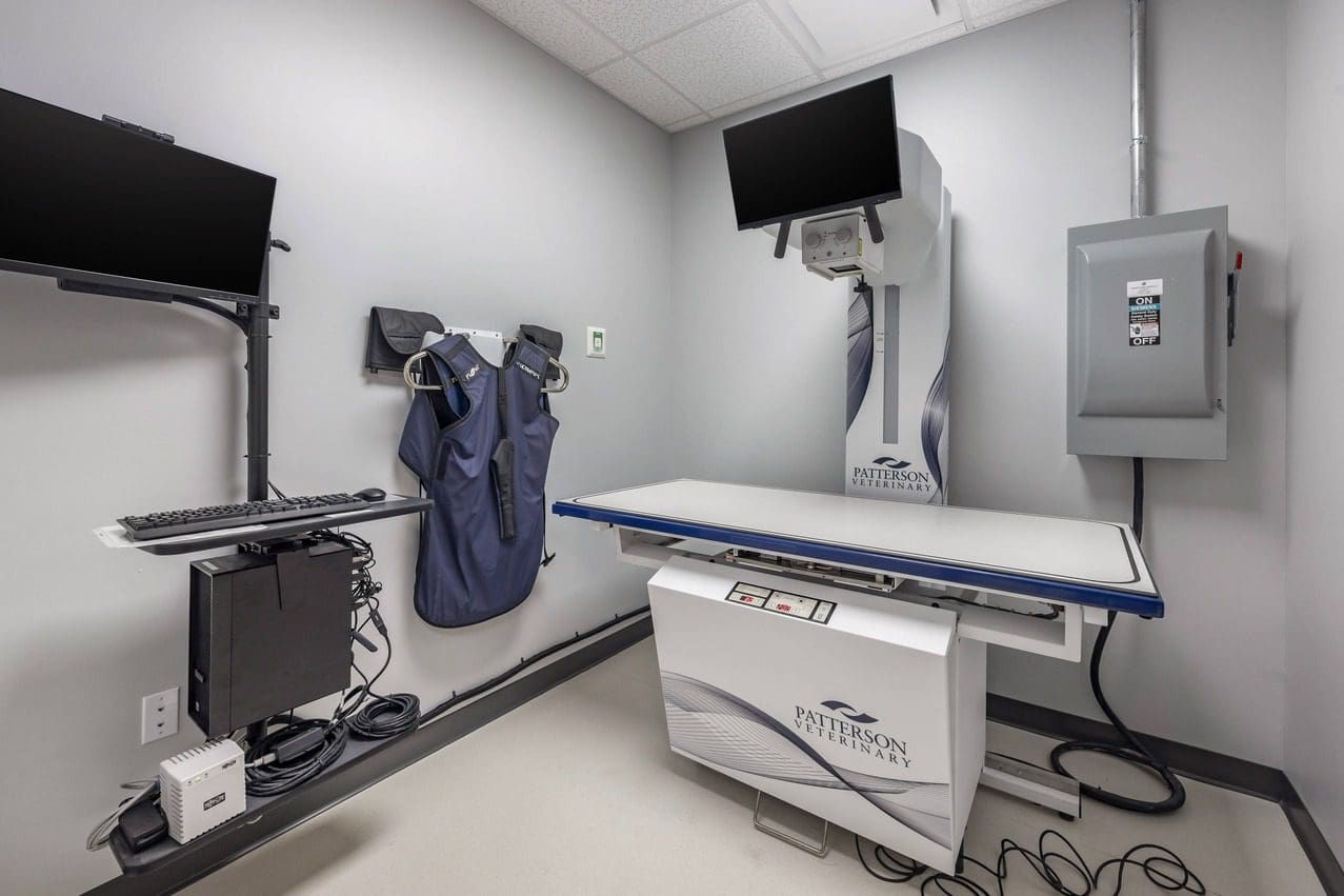 Empty X-Ray room with protective gear on wall